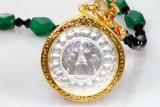 Thai Amulet silvered with haematite chain and gilt casing