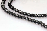 Thai Amulet silvered with haematite chain and gilt casing